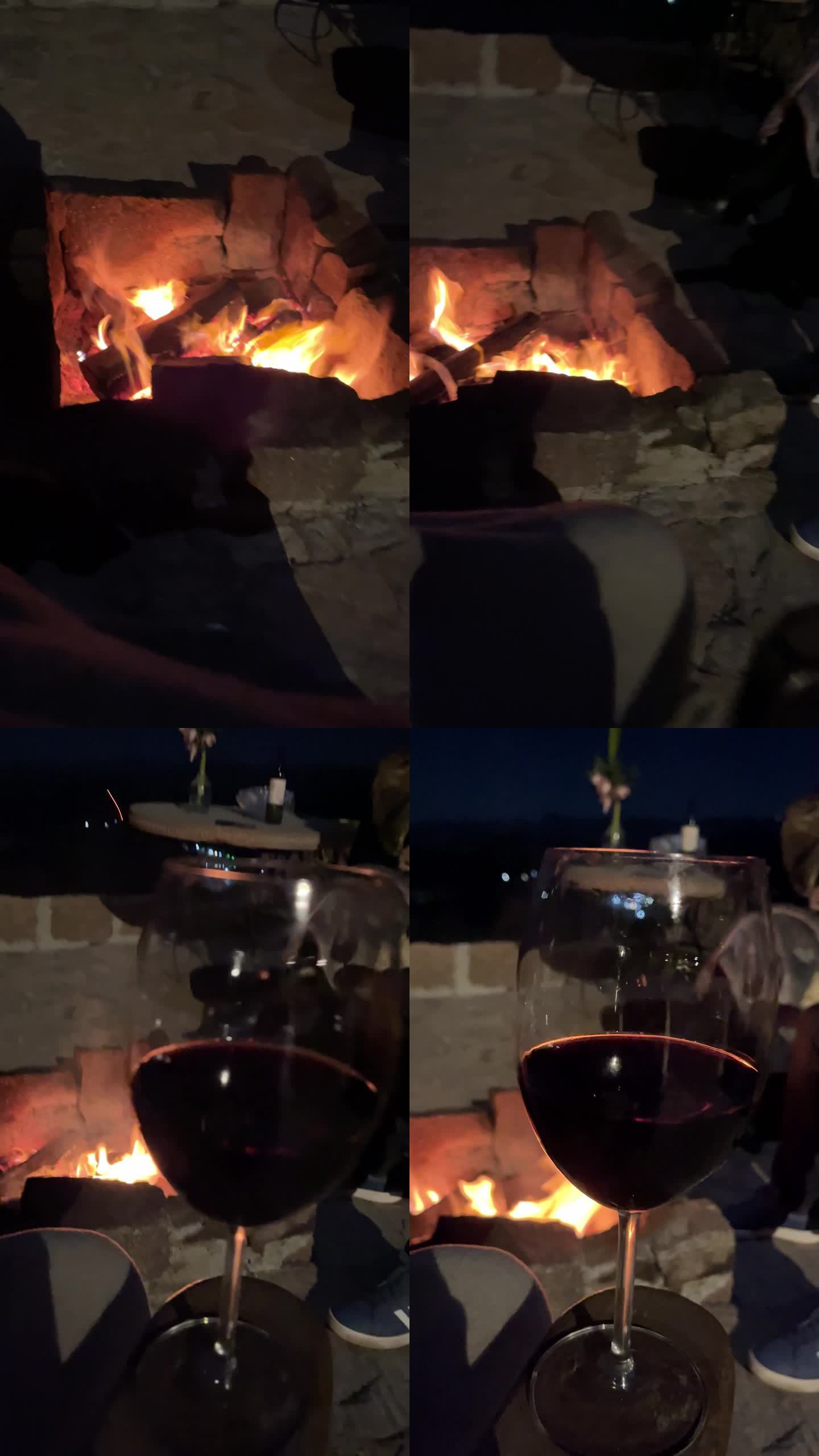 男子在火坑和晚上喝酒瓶-移动拍摄pov