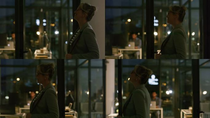 一位年轻女商人在一次会议后深夜离开现代办公室的4k视频片段