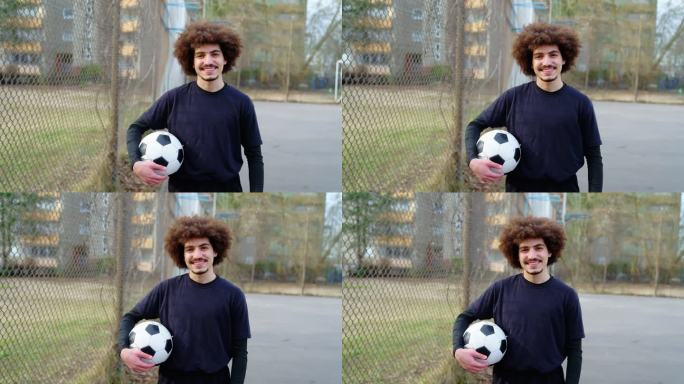 中东年轻男性球员手持足球的肖像