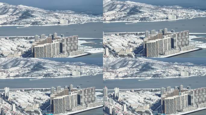 航拍雪后的威海湾九里与棉花山景观