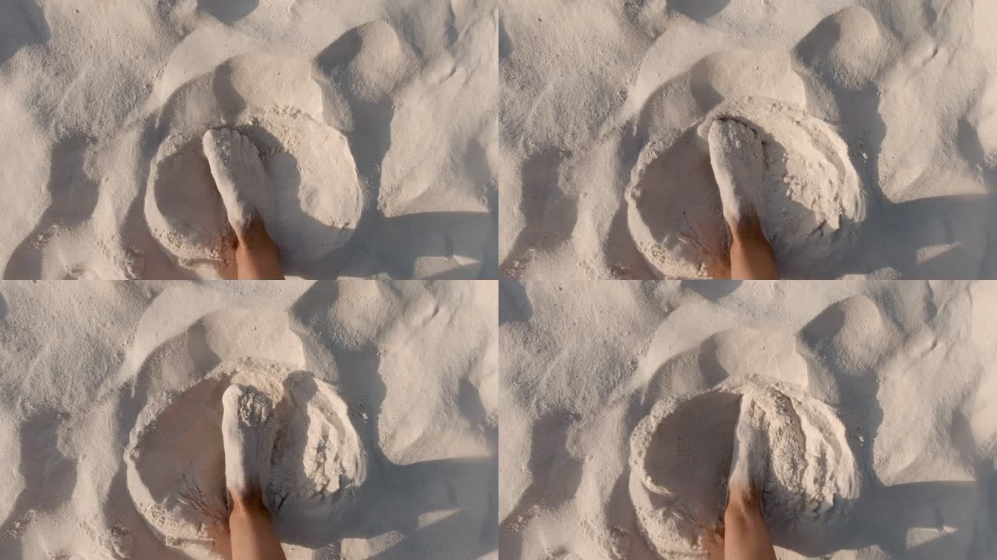 赤足脚趾间热带白色沙滩的POV