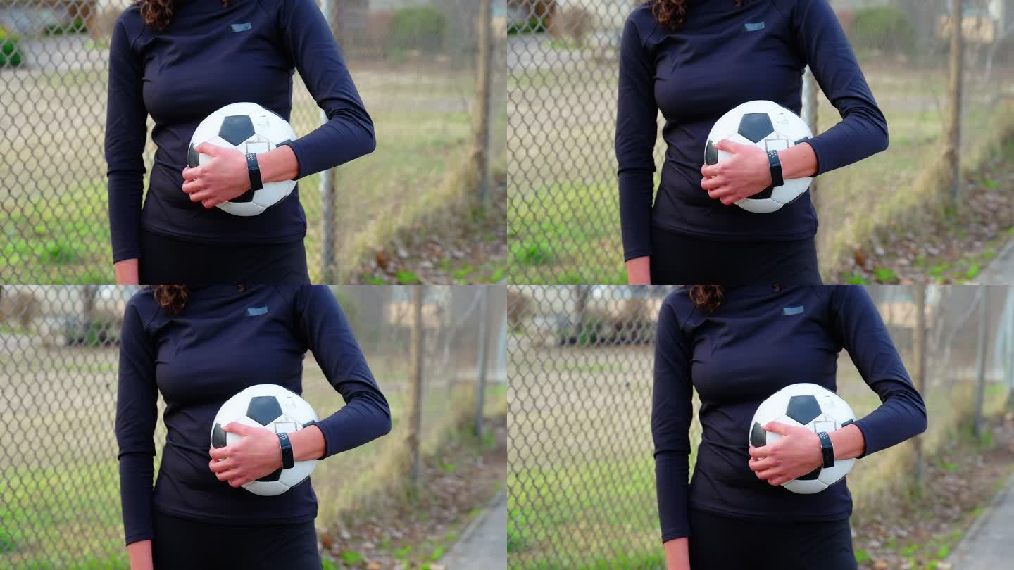 女子足球运动员在运动场上带球的特写镜头