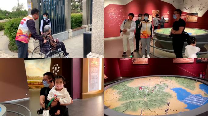 博物馆志愿者推老奶奶轮椅给游客免费讲解