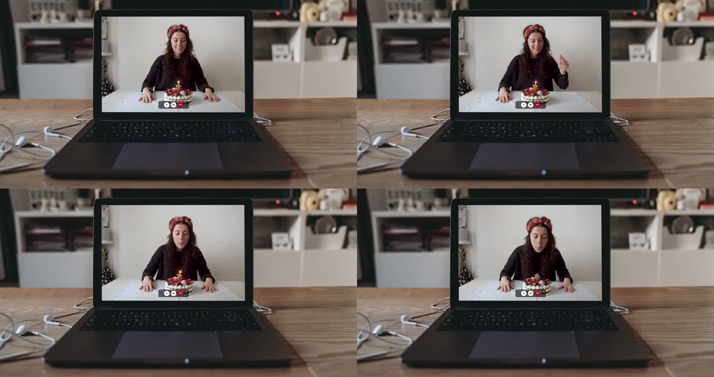 屏幕上有一个女人和她的生日蛋糕的笔记本电脑慢镜头视频