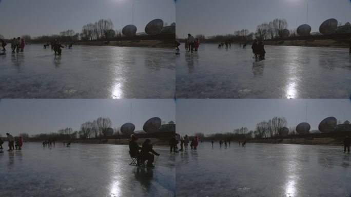 冰冻湖面滑冰爬犁的孩子