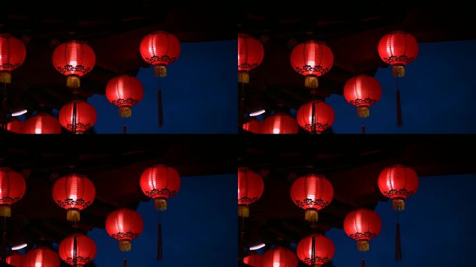 夜晚，古老的传统寺庙上挂着圆形的红色灯笼。
