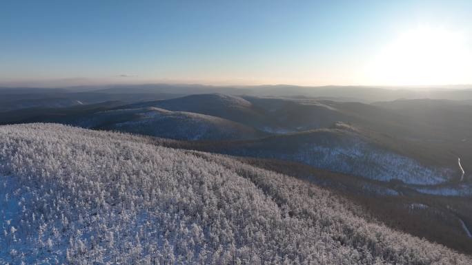 航拍夕阳下的林海雪原山林