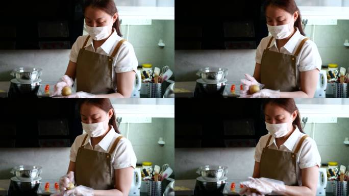 亚洲女人在厨房做月饼面团