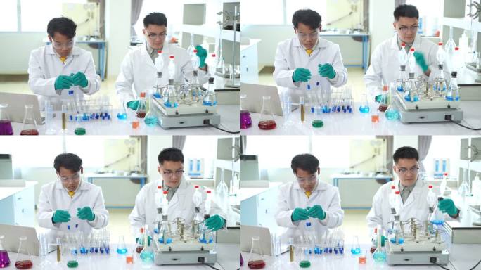 一名亚洲医学科学家小组的研究人员身穿实验服和防护设备，在寻找潜在的新冠肺炎疫苗时，仔细检查、测量和处