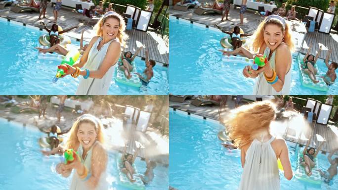 SLO MO金发女子在泳池派对上拿着水枪，对着相机镜头喷水