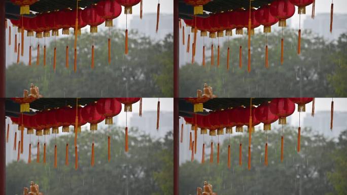 下雨天，古老的传统寺庙上挂着圆形的红灯笼