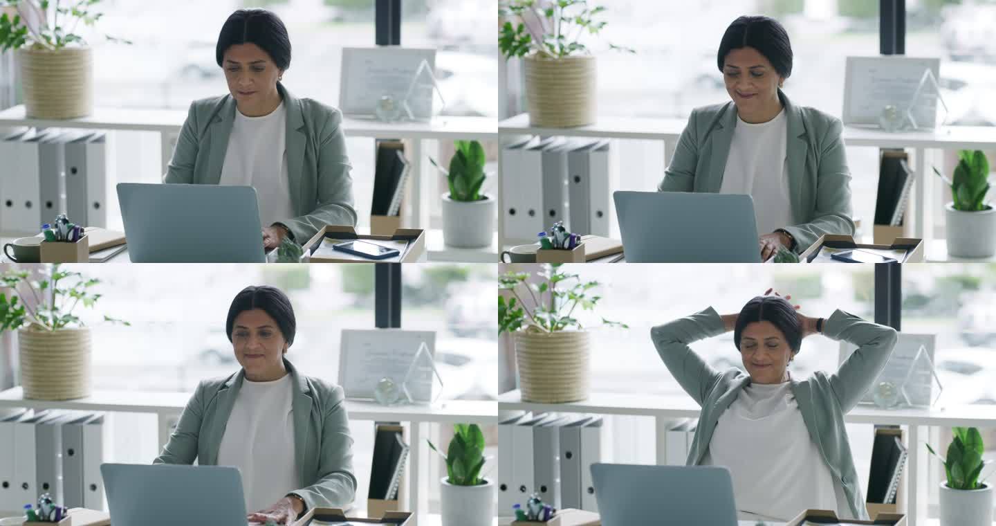 一位成熟的女商人在办公室用笔记本电脑工作时休息的4k视频片段