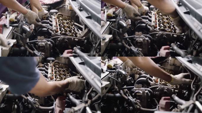 汽车技师的手协作修理和维护发动机气门和气缸体。