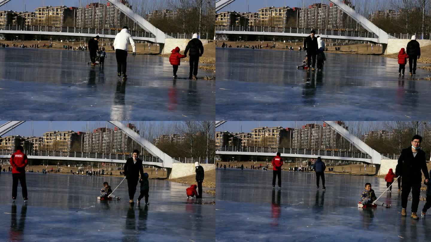 冰上拉爬犁的爸爸与孩子