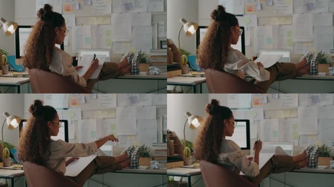 一位年轻女商人在家工作时做笔记的4k视频片段