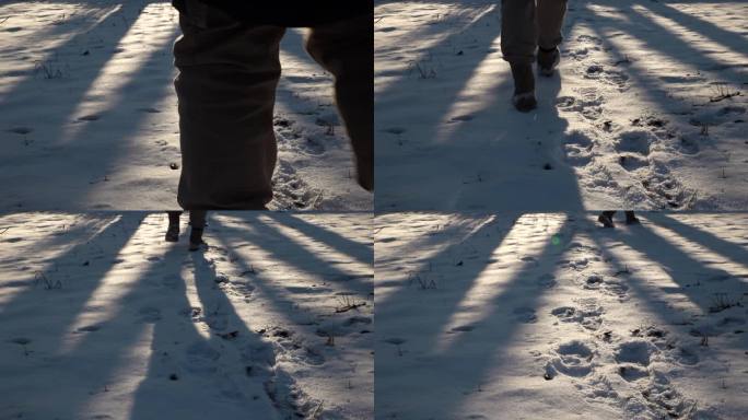 雪地光影踏雪而行雪地脚印行走在雪地上