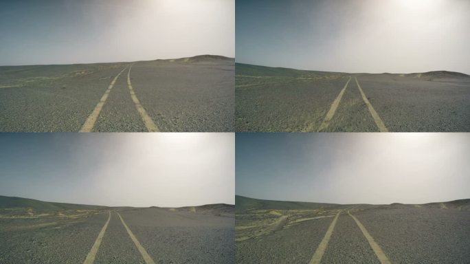 中国新疆戈壁沙漠上行驶的汽车。