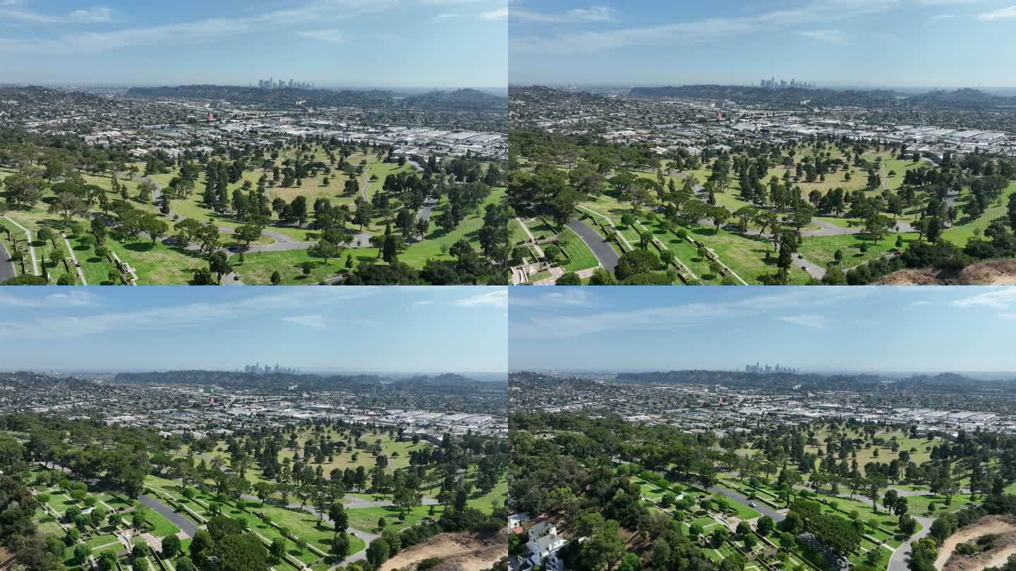 空中拍摄森林草坪公墓和洛杉矶城市蔓延
