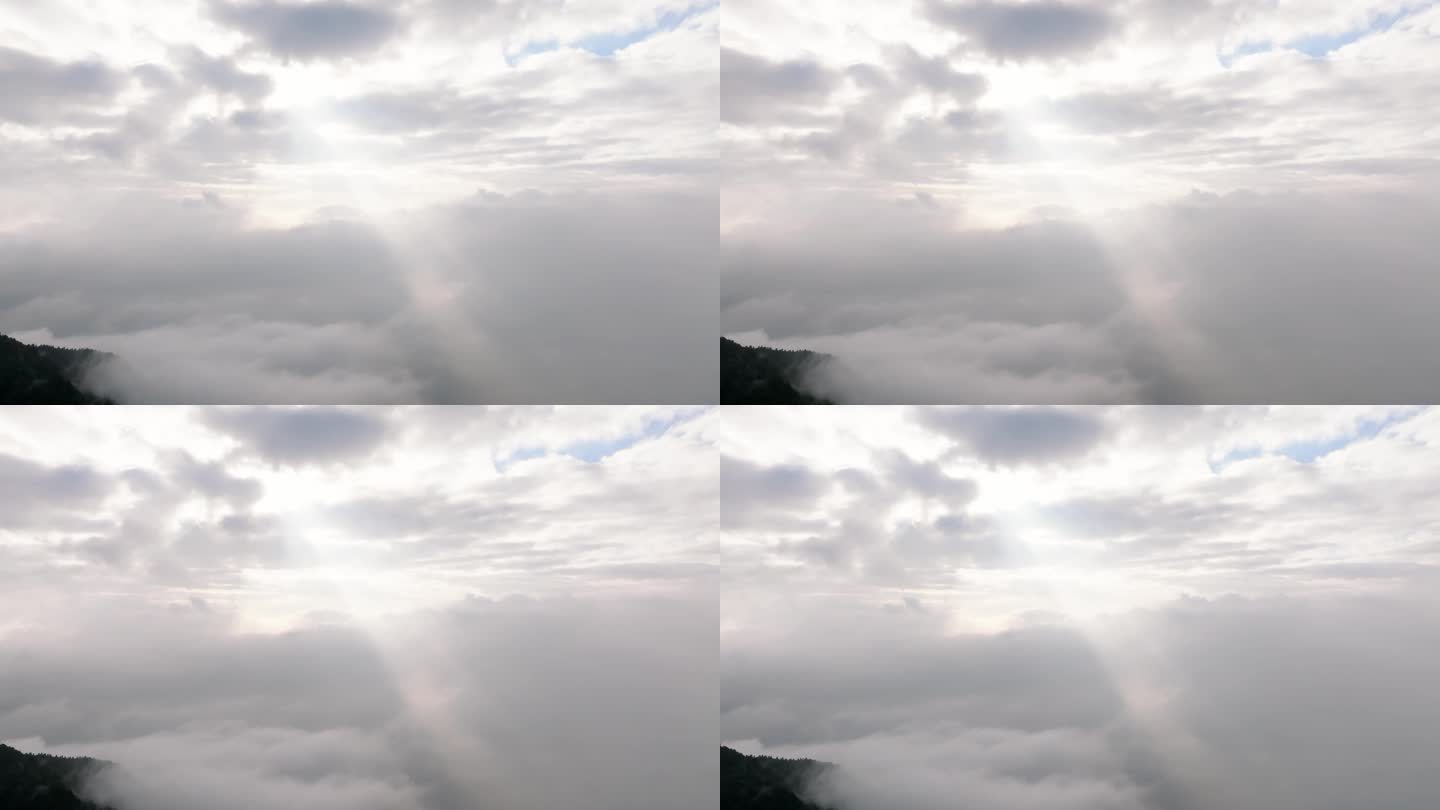 航拍丁达尔现象光束从云海中射出
