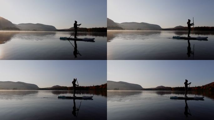 加拿大魁北克省特伦布兰特山国家公园，秋天在湖上划船的女子