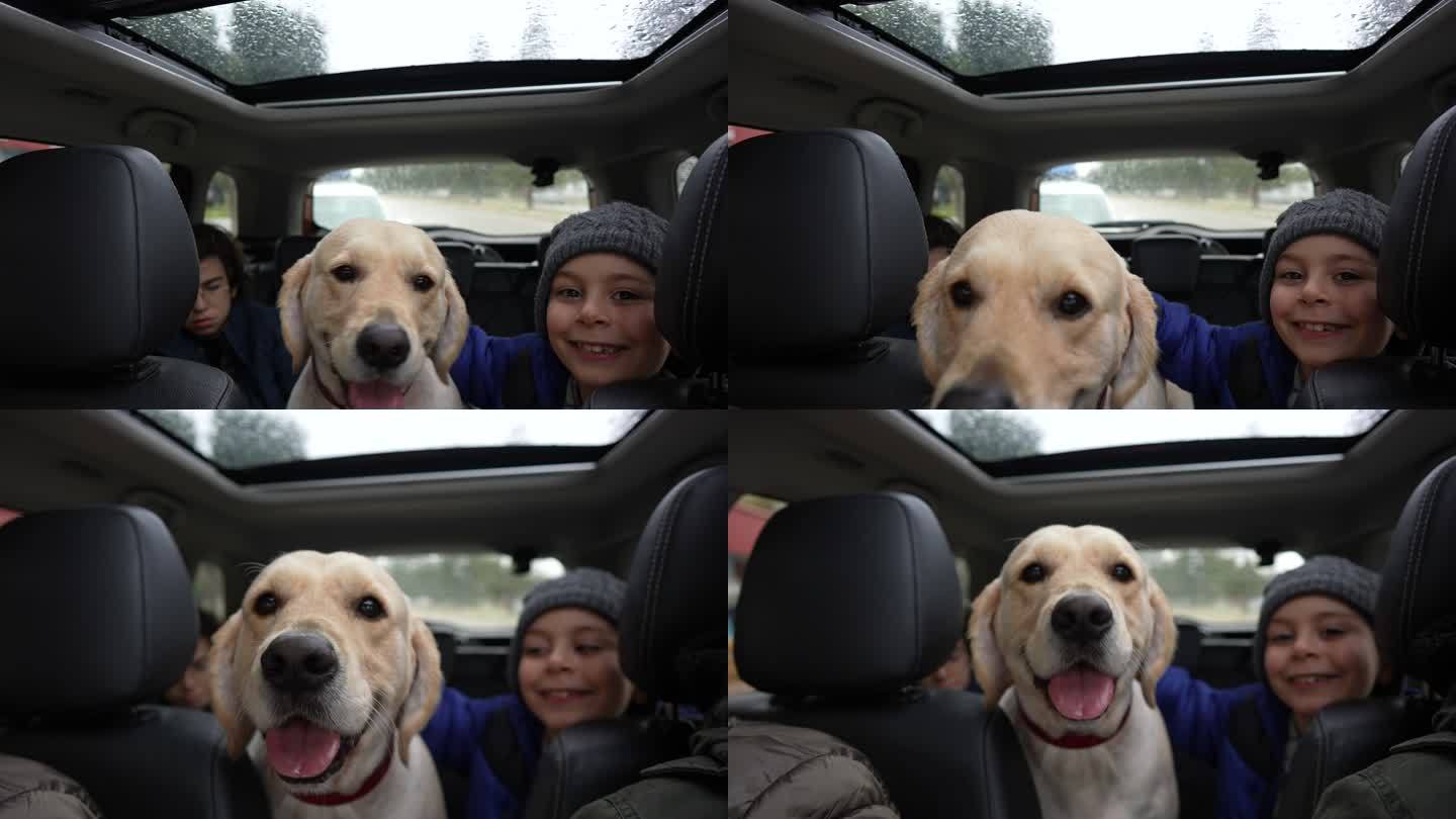 快乐的兄弟和他们的狗在路上旅行。