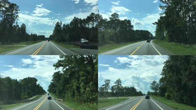在佛罗里达州米德尔堡郊外的乡村公路上，夏日的炎热，远处的云层在天空中形成