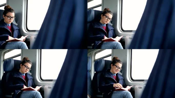 在火车上看书的年轻女子