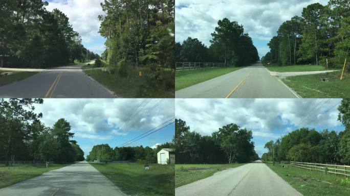 夏天开车沿着绵延起伏的丘陵上笔直的乡村街道行驶，靠近佛罗里达州米德尔堡，长满了草地和树木