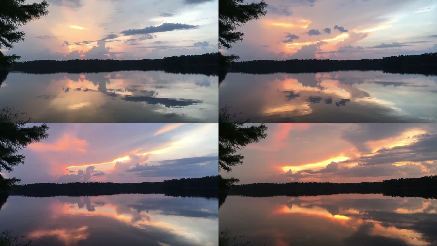森林湖中反射的彩色晚霞的时间流逝