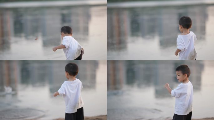 男孩快乐的向水中扔石头