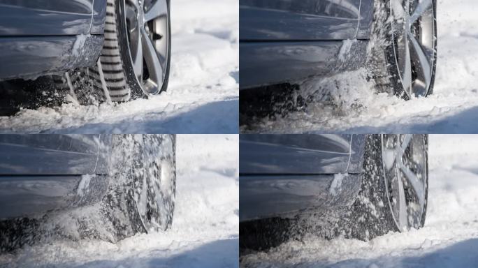 一辆陷在雪地里的汽车的旋转车轮