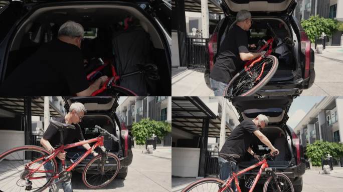 老年男子将自行车装入SUV汽车后备箱。