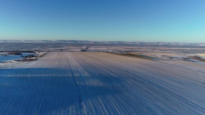 航拍东北苍茫雪原田野暮色