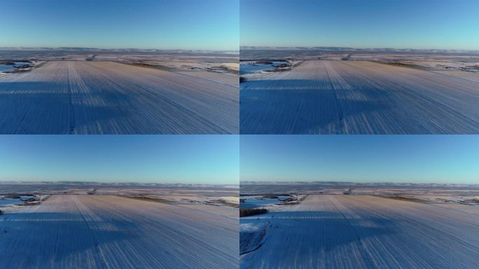 航拍东北苍茫雪原田野暮色