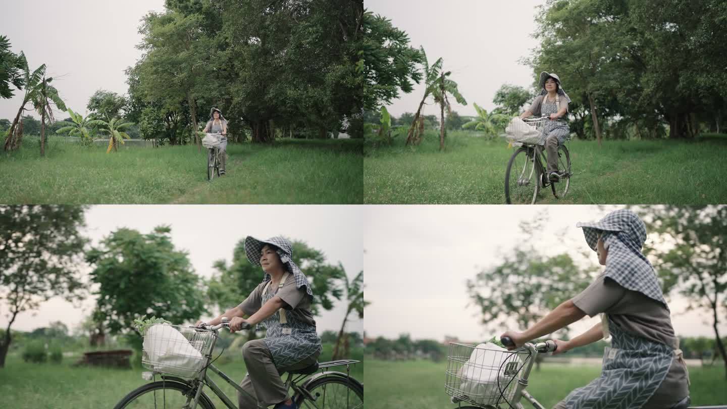 女人骑自行车骑车草坪小路