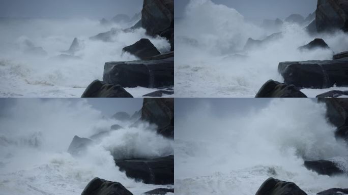 海浪喷向岩石汹涌澎湃巨浪海水冲刷