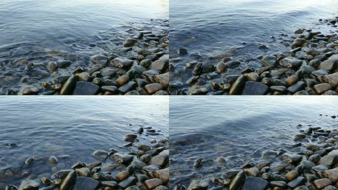 海浪平静地拍打着岸边的石头