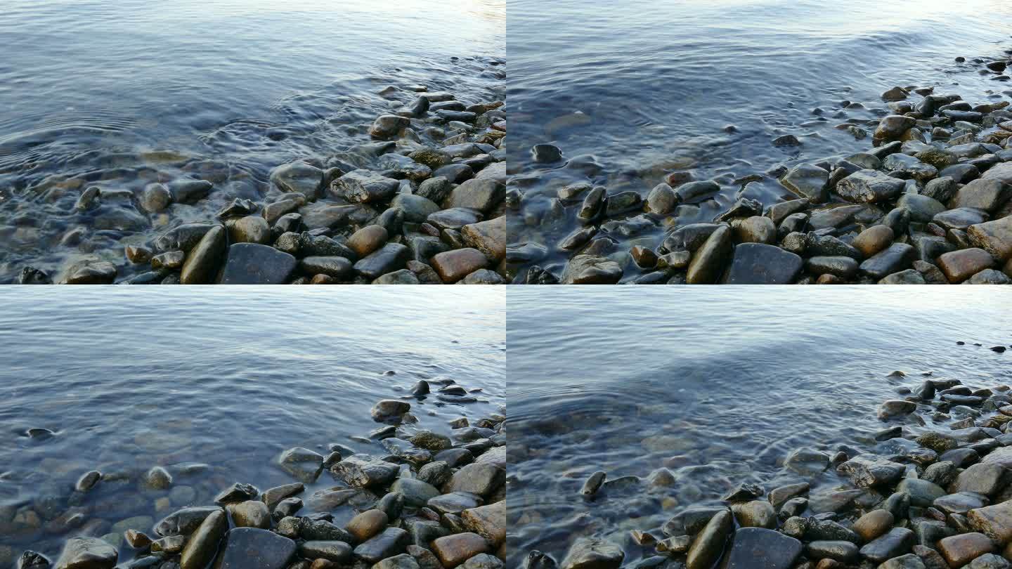 海浪平静地拍打着岸边的石头