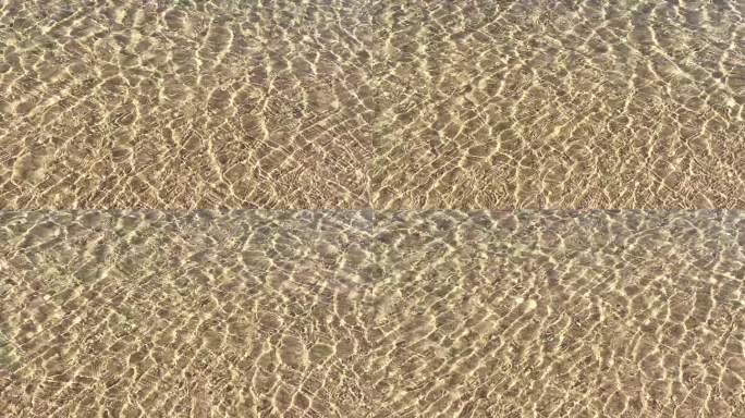 沙中流动的海水清澈见底水流水波