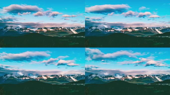 云南梅里雪山早晨，蓝天下的流云与群山