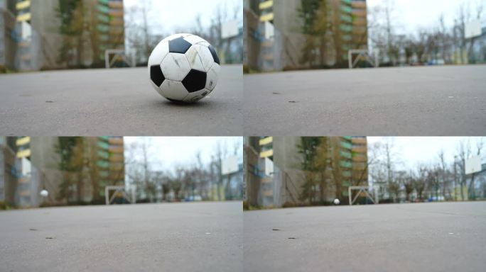 一名足球运动员在城市运动场踢足球的特写镜头