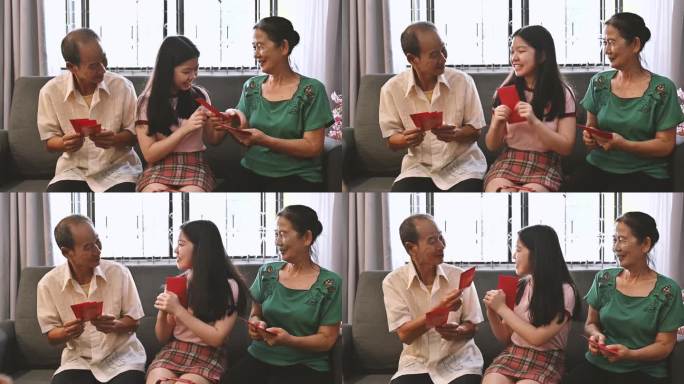 亚洲外孙女在客厅迎接并收到来自祖父母的中国新年红包（Angpow）