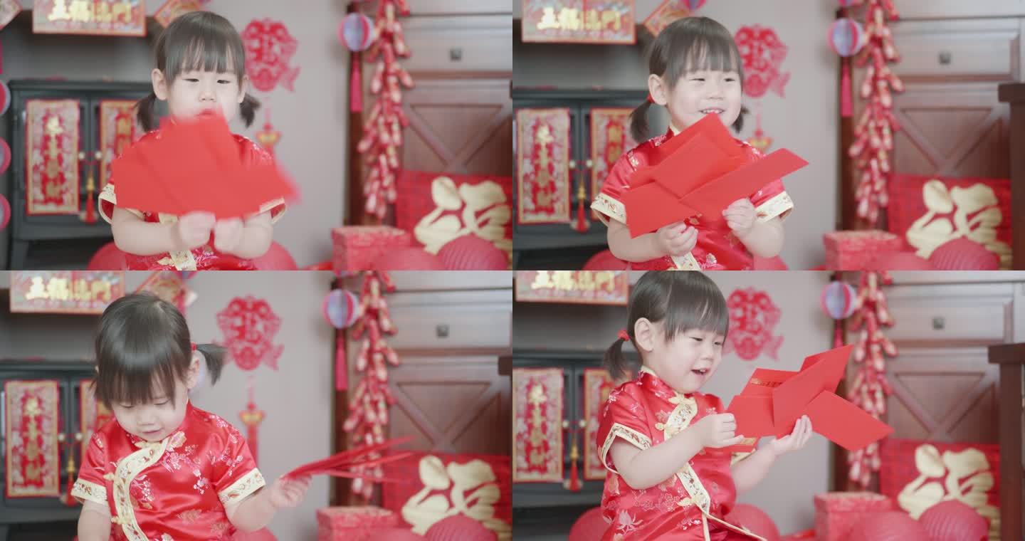 中国蹒跚学步的女孩在家庆祝中国新年