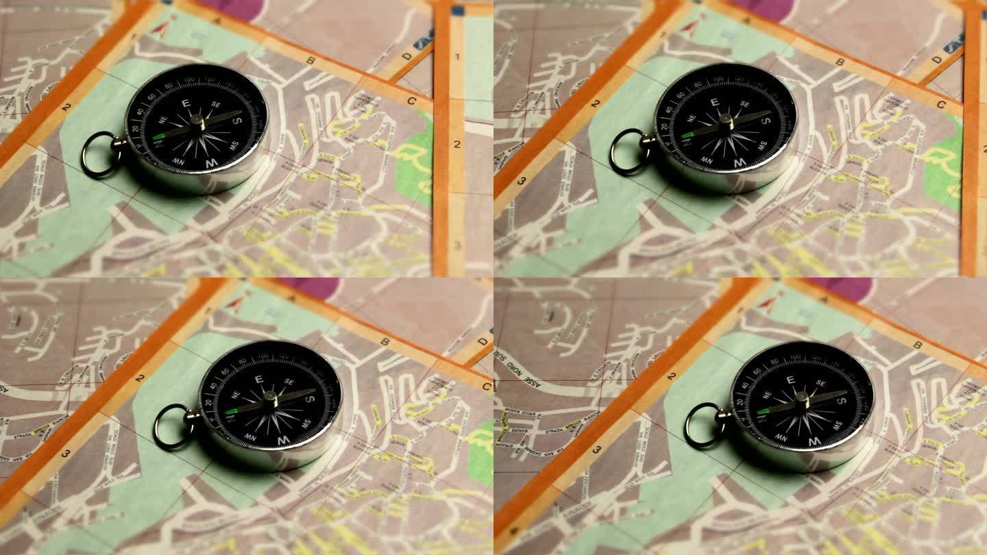 指南针指示意大利城市地图上的正确路径