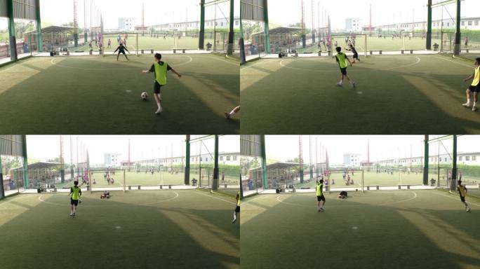 无人机射击：亚洲男子足球运动员与朋友一起打球。
