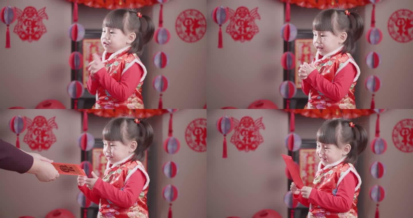 蹒跚学步的女孩穿着传统服装庆祝中国新年