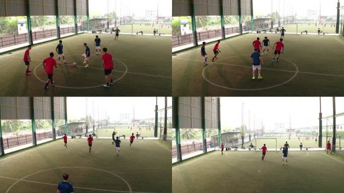 鸟瞰图：在比赛中，年轻人在球场上运球