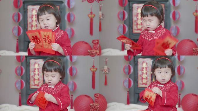 中国蹒跚学步的女孩在家里庆祝中国新年