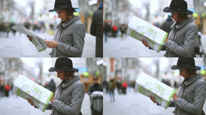 在维也纳看地图的年轻女人