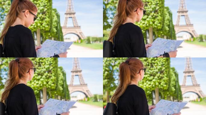 在战神花园的女游客，拿着巴黎城市地图，看着埃菲尔铁塔